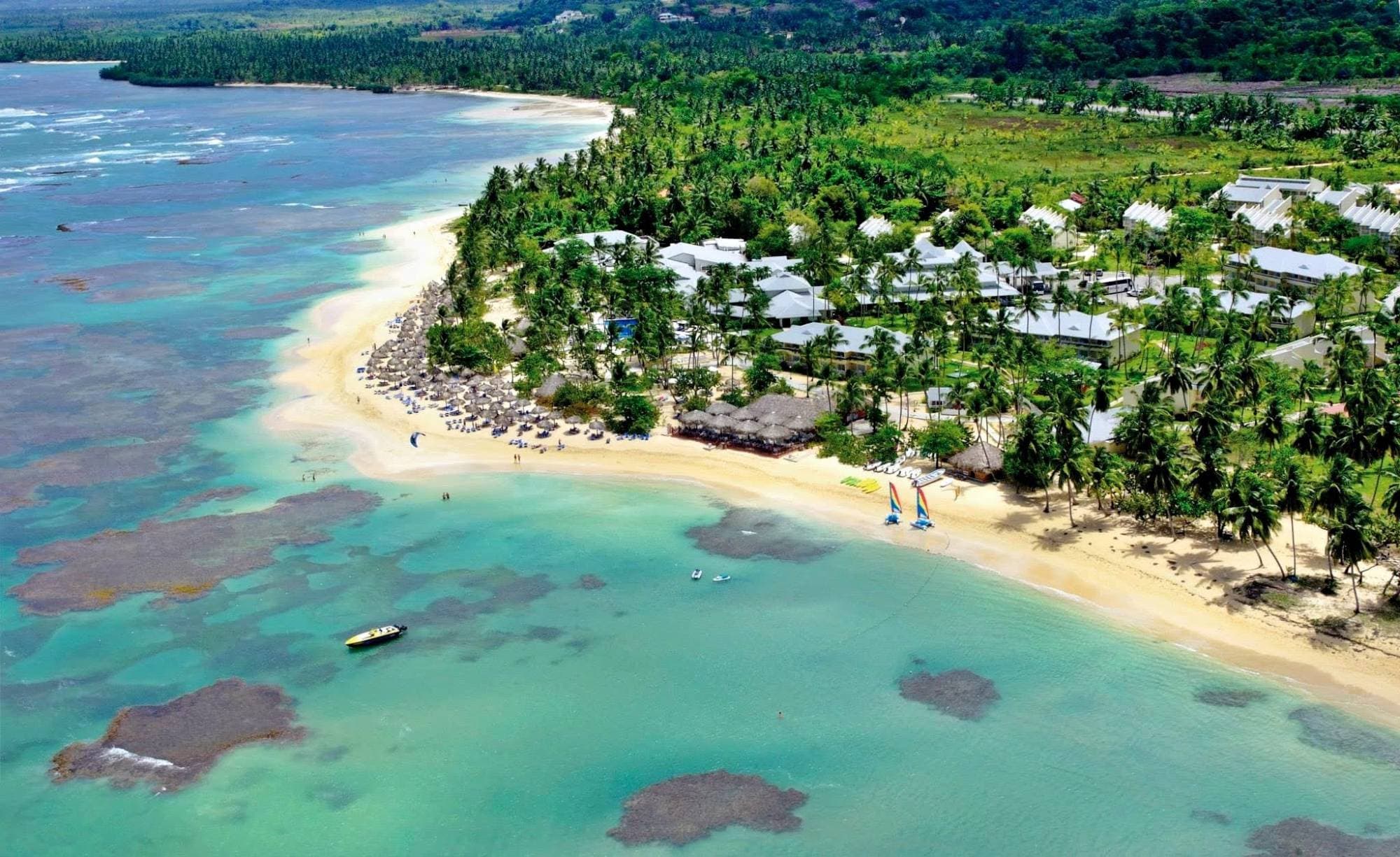 Aerial view of the beach and resort buildings at El Portillo, Samaná