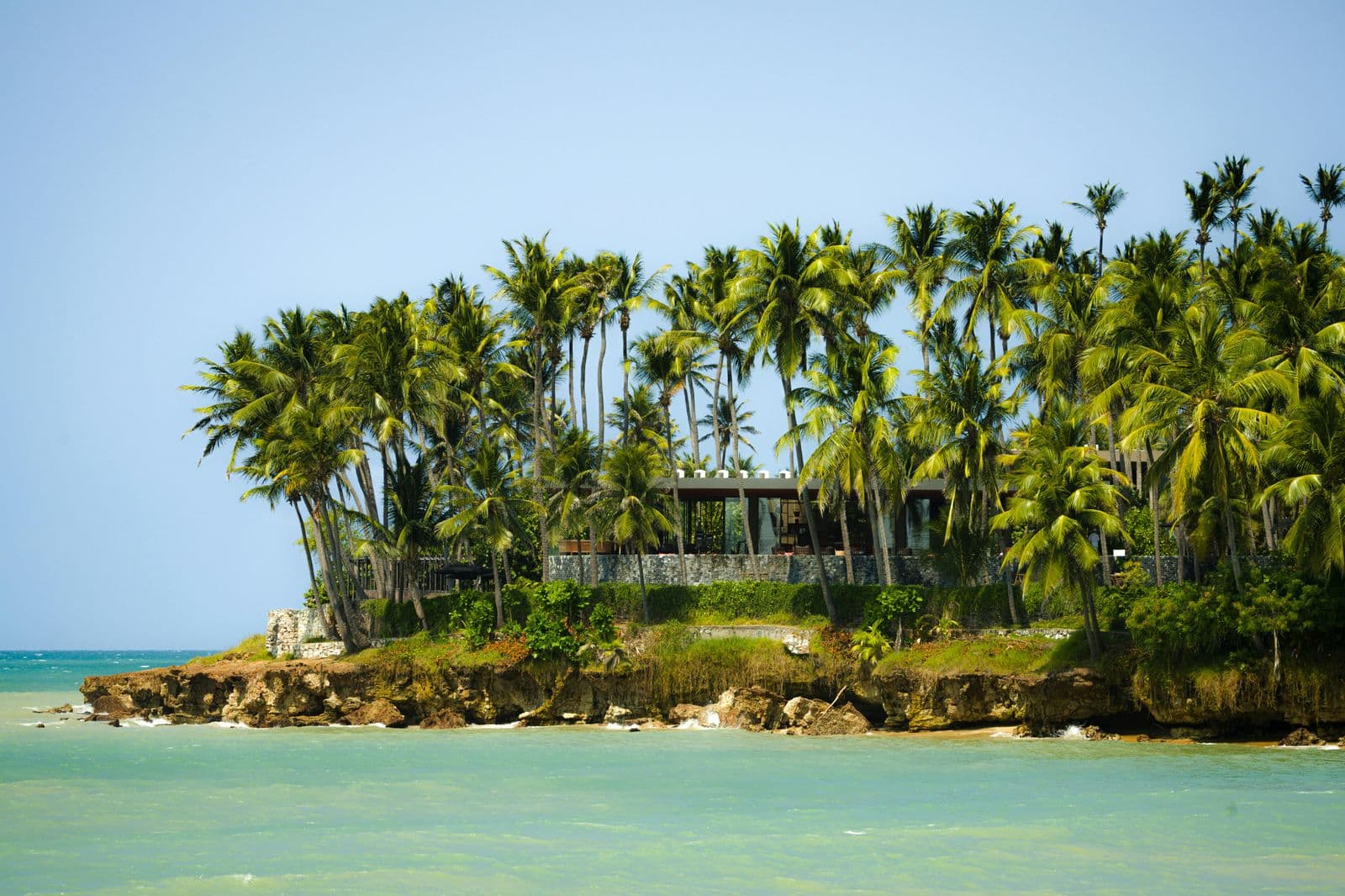 Beachfront property among palm trees on the Samaná coast