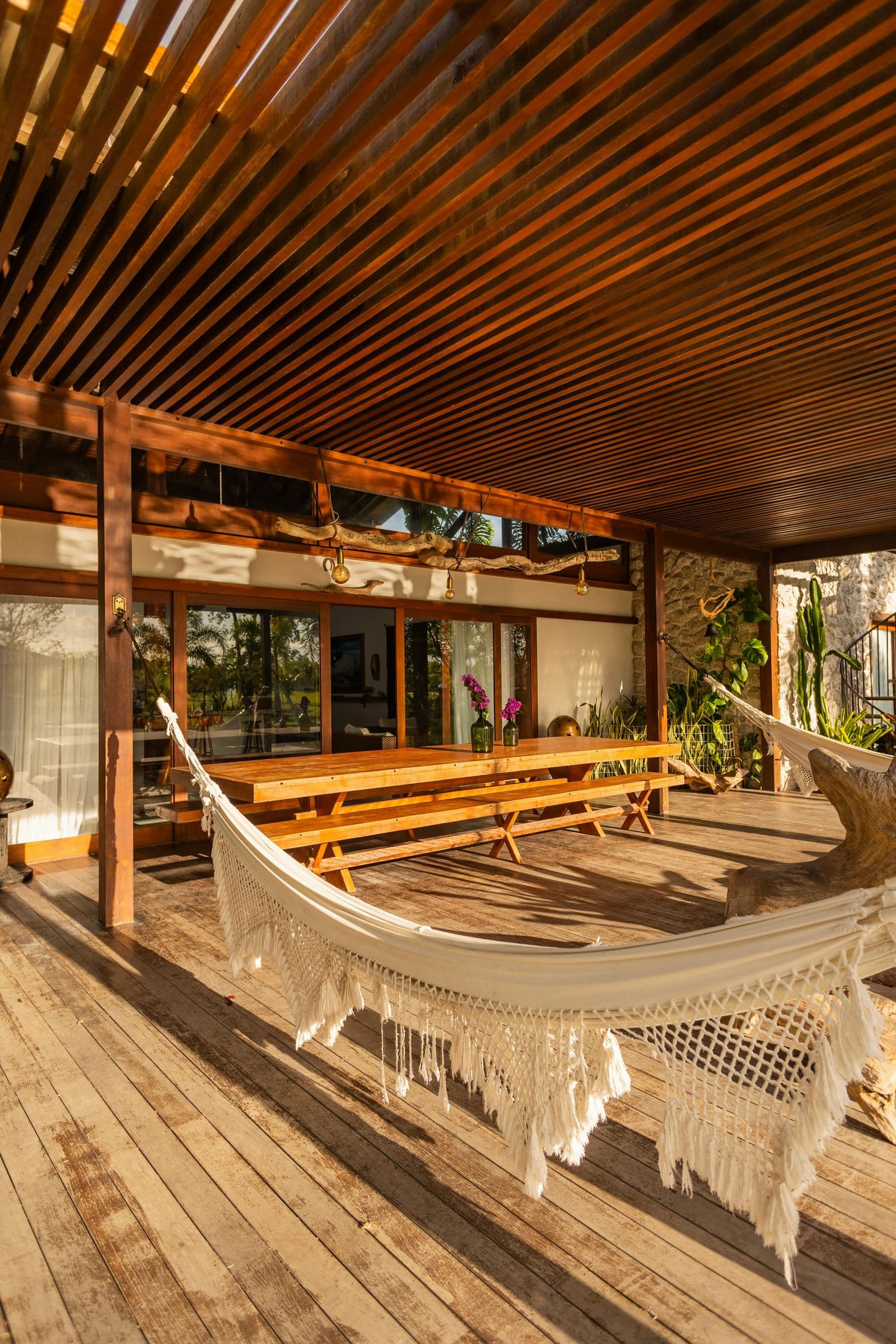Wooden terrace with hammock at a tropical vacation rental